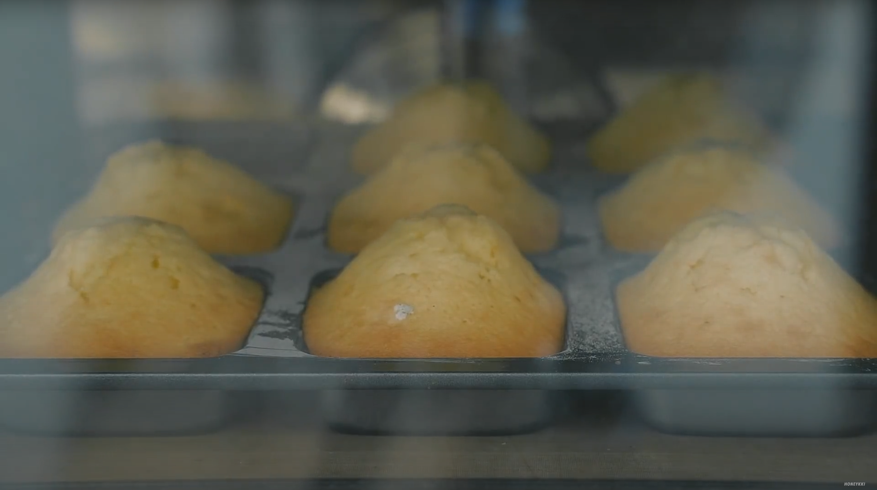 image of mini pound cakes rising in the oven